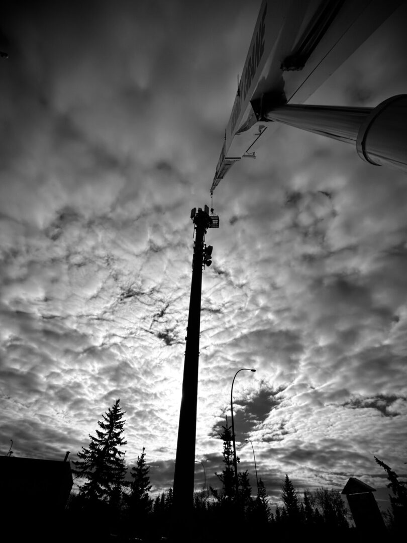 A black and white photo of the sky with clouds